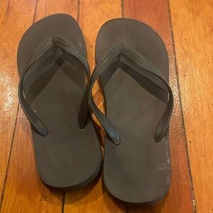 Brown Old Navy flip flops. Men’s size 12. Women’s size 14.
